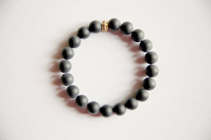 Matte Black Onyx Bracelet with a Gold Filled Charm